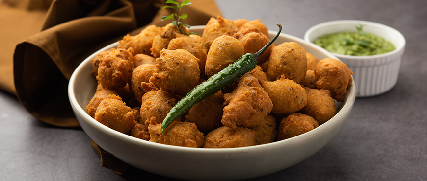 A spread of Bhai Dooj Special Snacks to Celebrate the Beautiful Occasion 4 Moong Dal Bhajiya