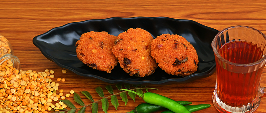 A spread of Bhai Dooj Special Snacks to Celebrate the Beautiful Occasion 5 Toor Dal Fritters